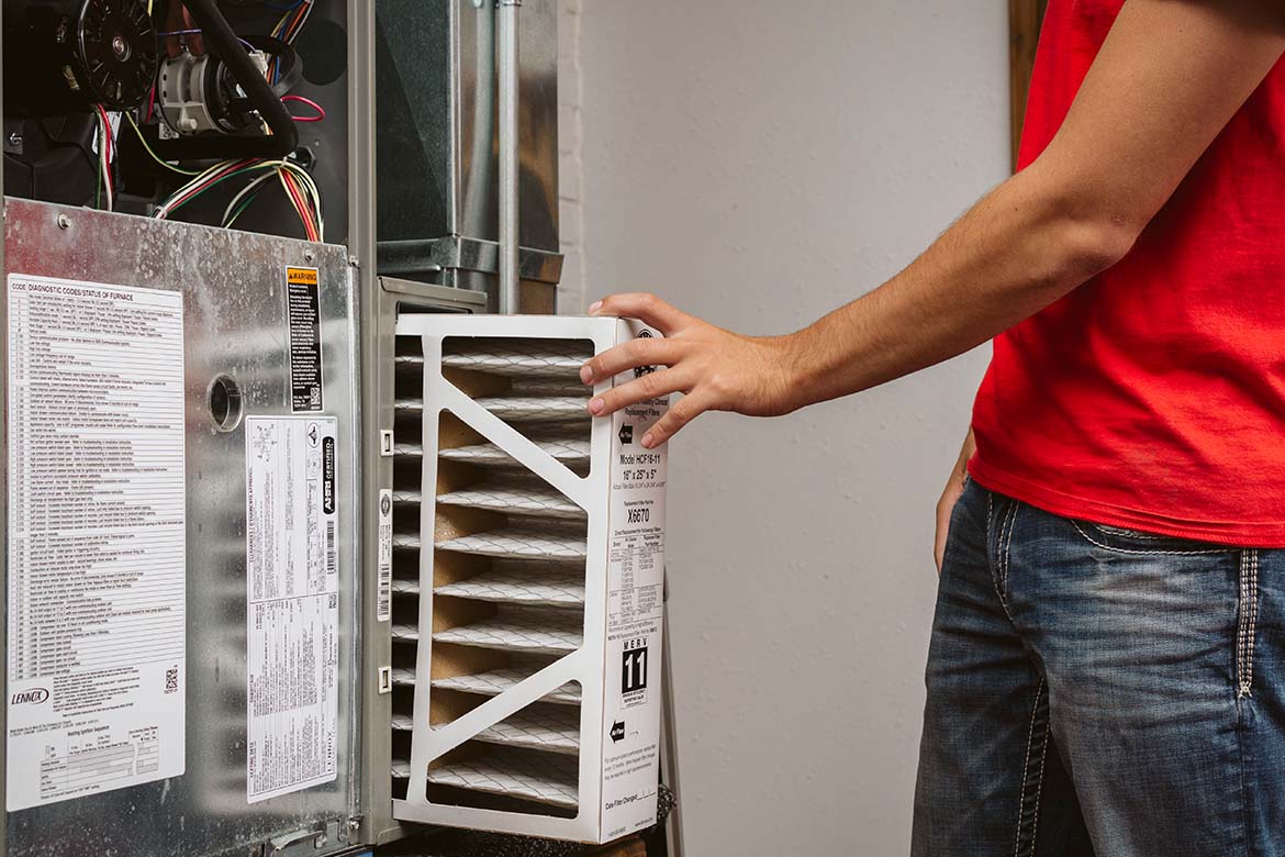 R&W worker replacing an air filter